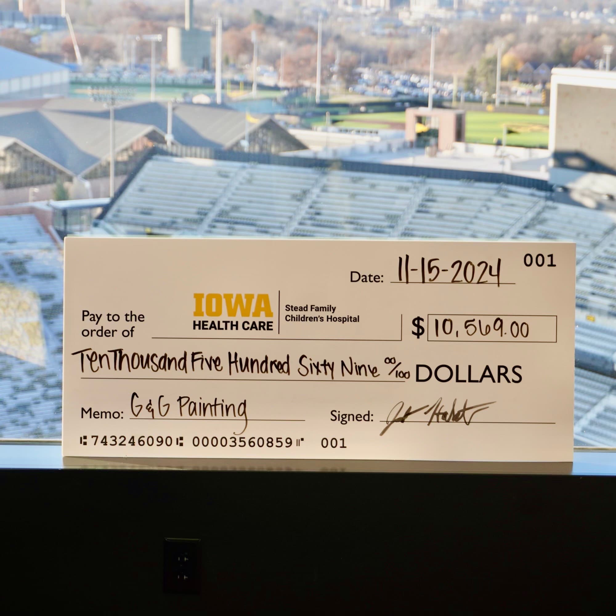 G & G team holding donation check for childrens hospital