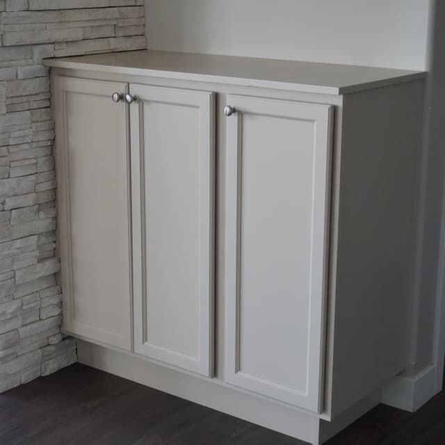 Refinished kitchen cabinets with smooth painted finish